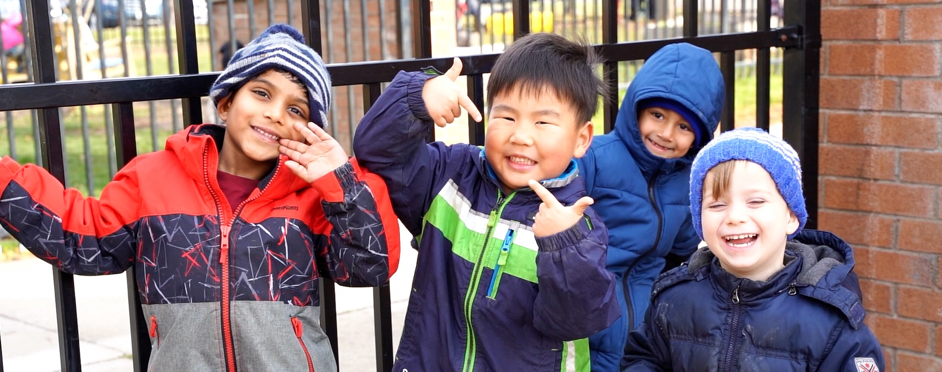 Kindergarten students smiling and playing