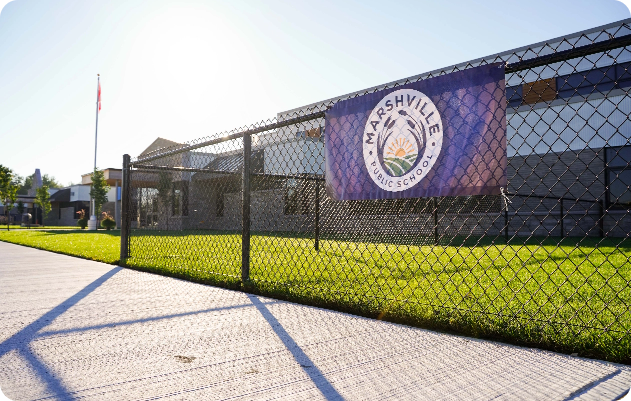 Marshville banner on fence outside school